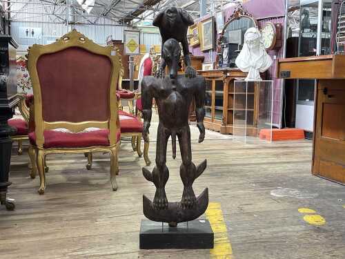 Hand carved timber tribal figure with crocodile face and bird to shoulders.