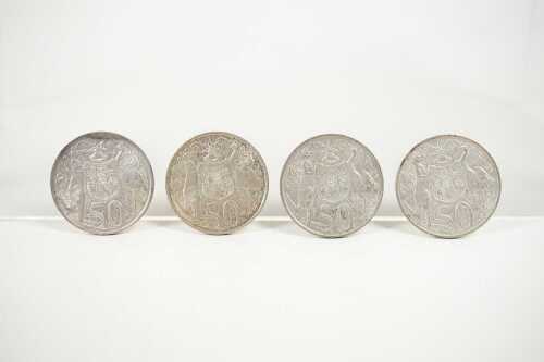 Four Australian round 50 cent coins