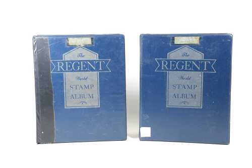 Two vintage Regent World stamp albums.