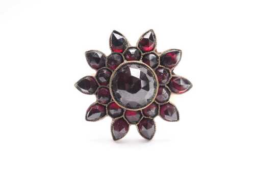 A vintage bohemian garnet ring in 9ct yellow gold.
