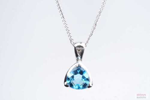 A blue topaz and diamond pendant and necklace in 14ct white gold.