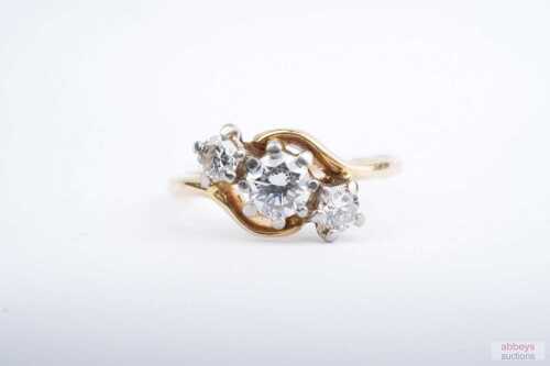 A three diamond ring in 18ct yellow gold.