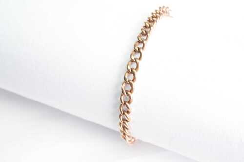 A vintage curb link bracelet in 9ct rose gold.