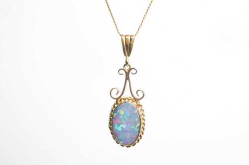 A vintage opal doublet pendant and necklace in 9ct yellow gold.