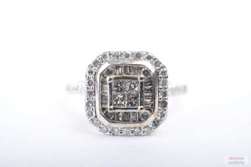 A diamond cluster ring in 9ct yellow gold.