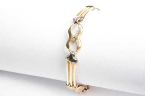 A fancy gate link bracelet in 9ct yellow and white gold.