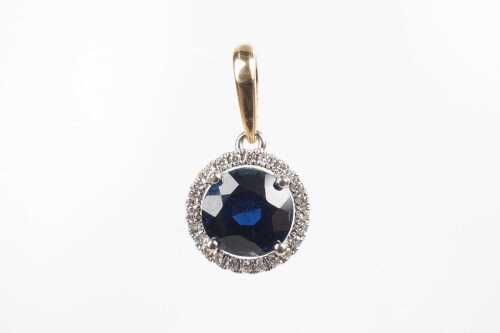 A sapphire and diamond pendant in 18ct yellow gold.