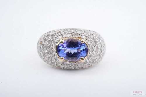 A tanzanite and diamond ring in 14ct yellow gold
