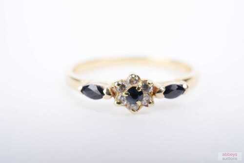 A sapphire and cubic zirconia ring in 18ct yellow gold.