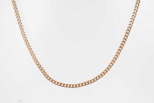 A curb link chain in 9ct yellow gold 56cm long. 4.55 grams.