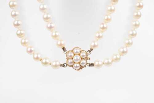 A double strand of pearls to a 14ct pearl set clasp.