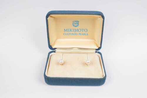 A pair of vintage Mikimoto pearl studs in 14ct yellow gold in original box.