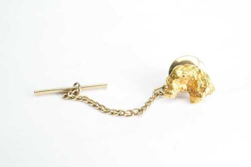 A gold nugget tie pin with 24ct gold nugget.
