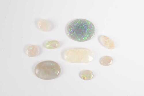A collection of eight solid opals and one doublet.