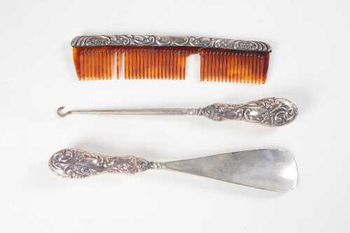 Four English sterling silver mounted dressing table items