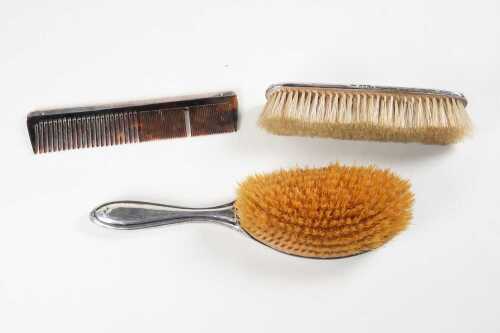 Three English sterling silver dressing table items