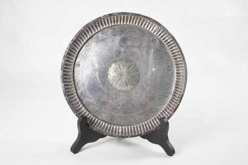 Silver salver with engraved designs and gadrooned edge