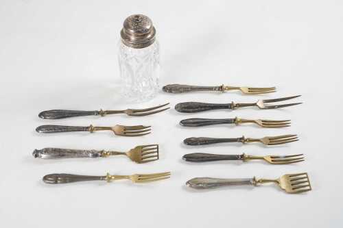 Ten pieces of 800 silver mounted cutlery, and an English sterling silver mounted crystal sugar castor