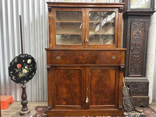 An early 19th century figured walnut secretaire cabinet