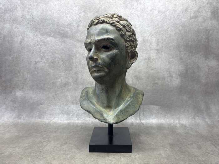 A Classical style cast bronze bust of a man