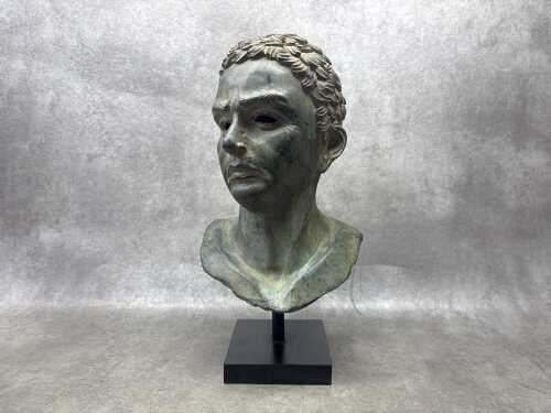 A Classical style cast bronze bust of a man
