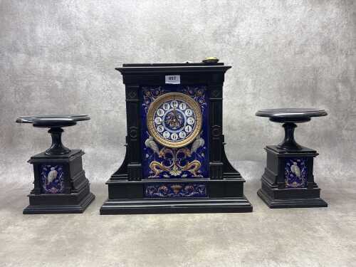A 19th century French mantel clock and garniture set