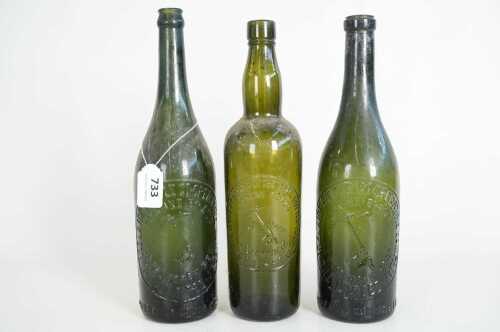 Three antique Pickaxe Brand Southwark Adelaide green glass beer bottles