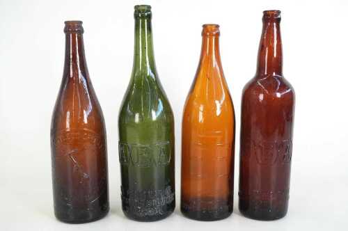 Four antique and vintage bottles including brown Pickaxe Brand beer, 2EE, and two ABA beer bottles.