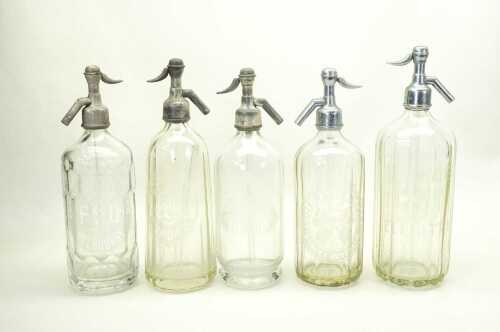 Five vintage soda siphons including Frankston Springs Co, Tooth and Co, Reed Bro, etc.