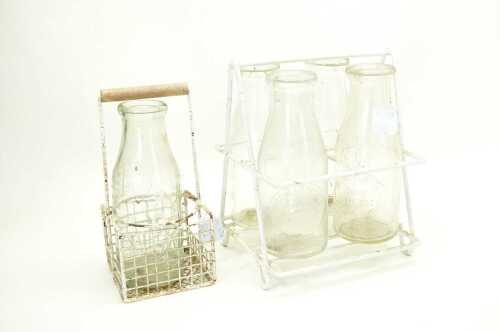 Five vintage Australian milk bottles with original carry baskets