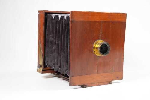 An antique 6&frac12; x 6&frac12;" mahogany tailboard camera