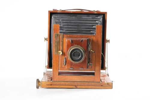 An antique 4&frac34; x 6&frac12;" plate mahogany field camera with Thornton-Pickard lens and shutter