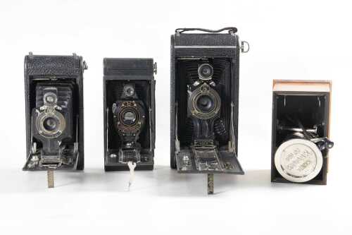 Three Kodak folding cameras, and Kodak developing tank