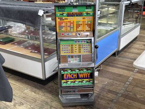 A vintage Nutt & Muddle & Sons Jubilee slot machine