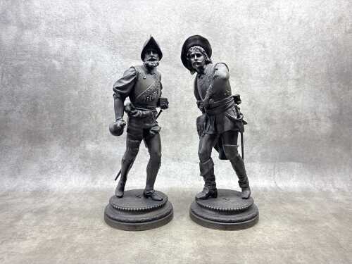 Pair of antique cast spelter musketeer statues