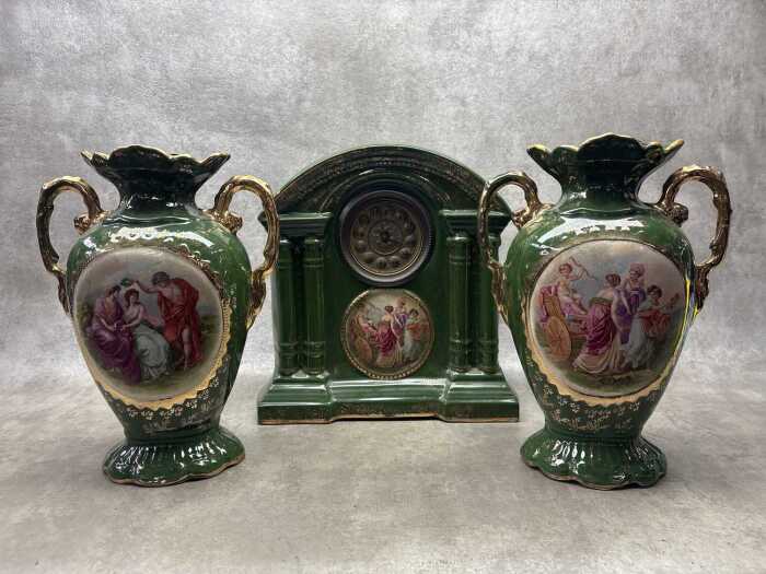 An antique English Royal Warwick green and gilt ceramic clock and garniture set