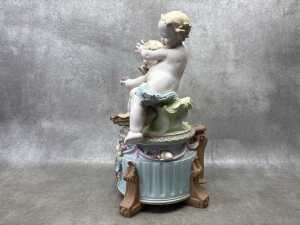 A German hand painted bisque porcelain figure of two babies playing in the garden - 2