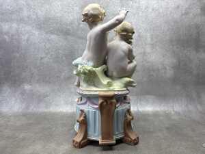 A German hand painted bisque porcelain figure of two babies playing in the garden - 3