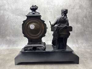 An antique Ansonia cast metal mantel clock with figure of seated lady - 2