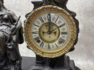 An antique Ansonia cast metal mantel clock with figure of seated lady - 3