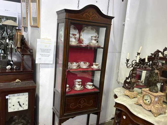An antique Sheraton Revival display cabinet