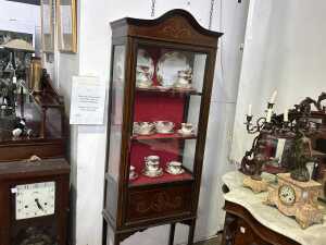 An antique Sheraton Revival display cabinet