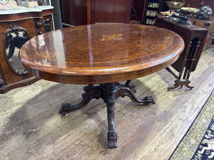 A Victorian burr walnut oval loo table