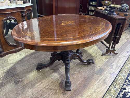 A Victorian burr walnut oval loo table