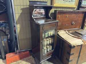 An antique mahogany music cabinet