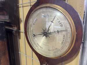 An antique mercury dial barometer with rosewood case. - 2
