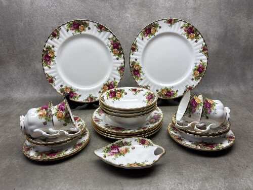 A Royal Albert Old Country Roses porcelain dinner setting for four
