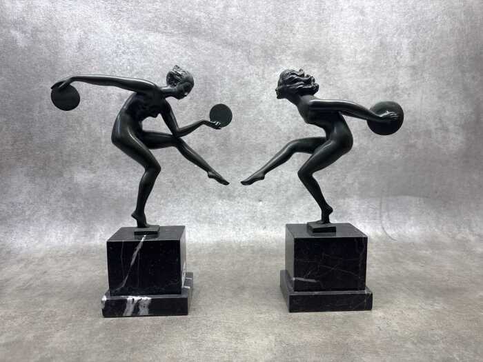 Pair of Art Deco style painted bronze figures on marble bases