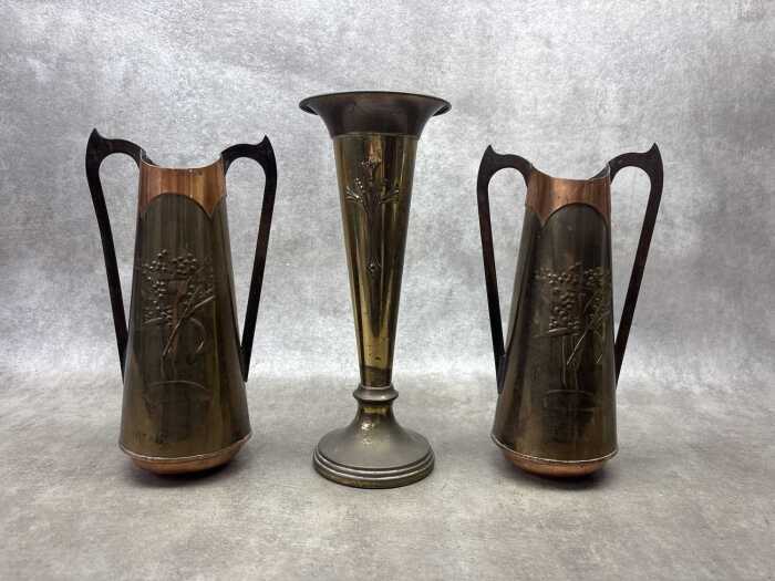 Three Art Nouveau brass vases including pair with repousse wattle design