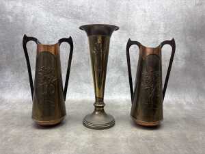 Three Art Nouveau brass vases including pair with repousse wattle design